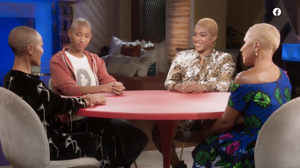 From left: Jada Pinkett Smith, Willow Smith, Tiffany Haddish, and Adrienne Banfield Norris sitting at a red table.