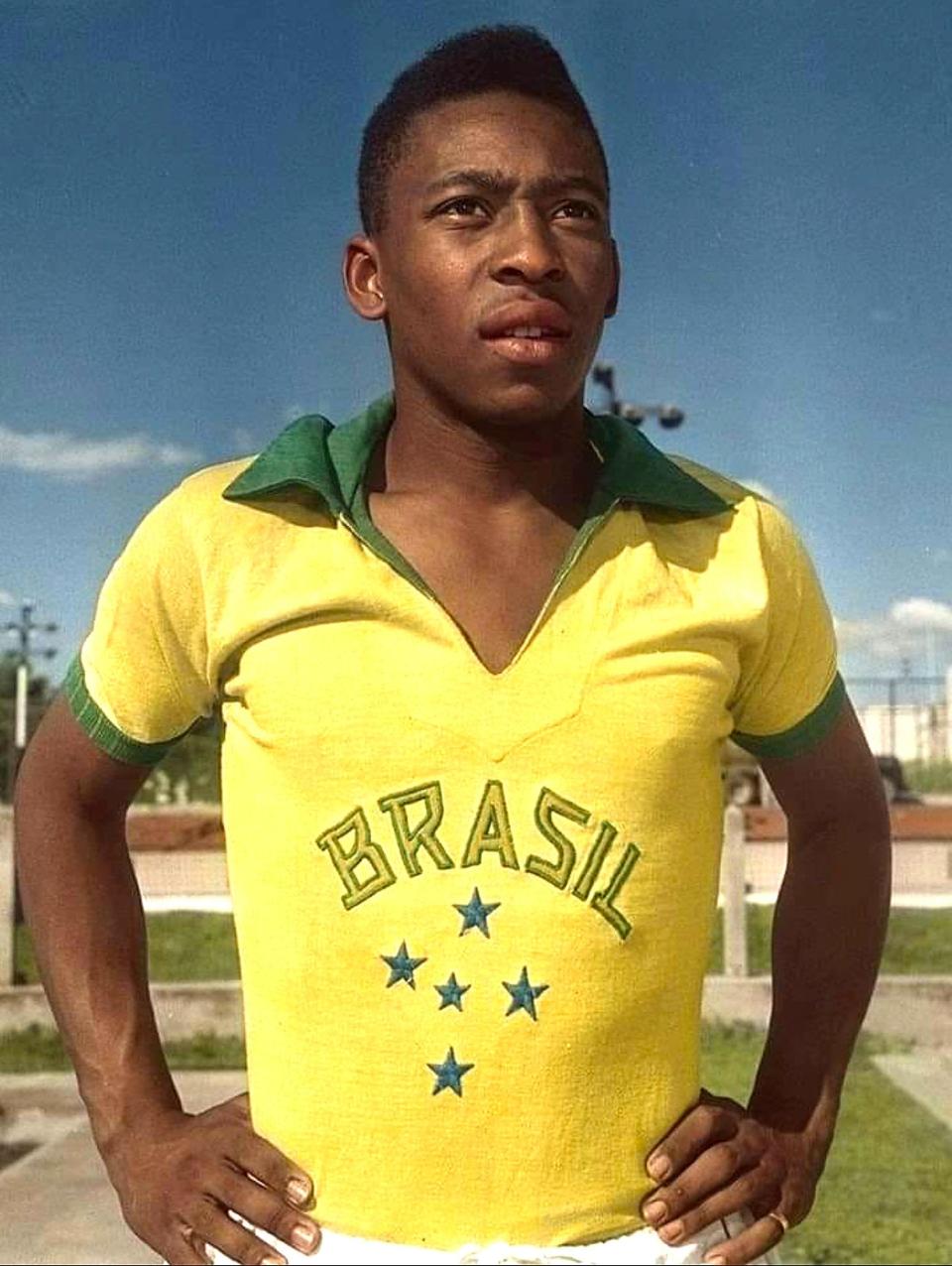 Pelé wearing a yellow Brazil soccer jersey