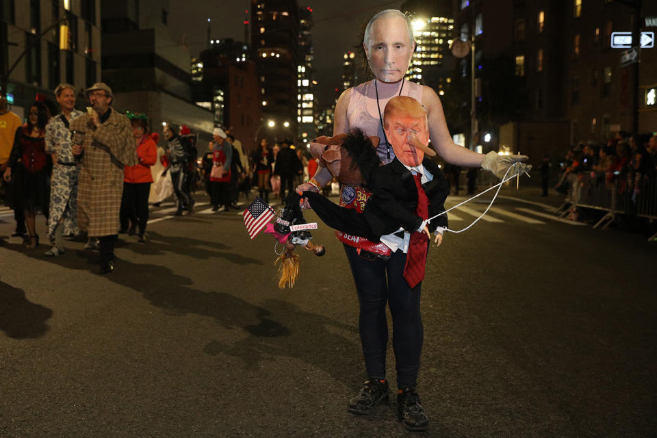 A reveler wearing a political costume featuring Donald Trump and Vladimir Putin marches in the 46th annual Village Halloween Parade in New York City. (Gordon Donovan/Yahoo News)