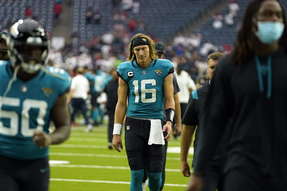 Jacksonville Jaguars quarterback Trevor Lawrence (16) walks off the field after an NFL football game against the Houston Texans Sunday, Sept. 12, 2021, in Houston. The Texans won 37-21. (AP Photo/Sam Craft)