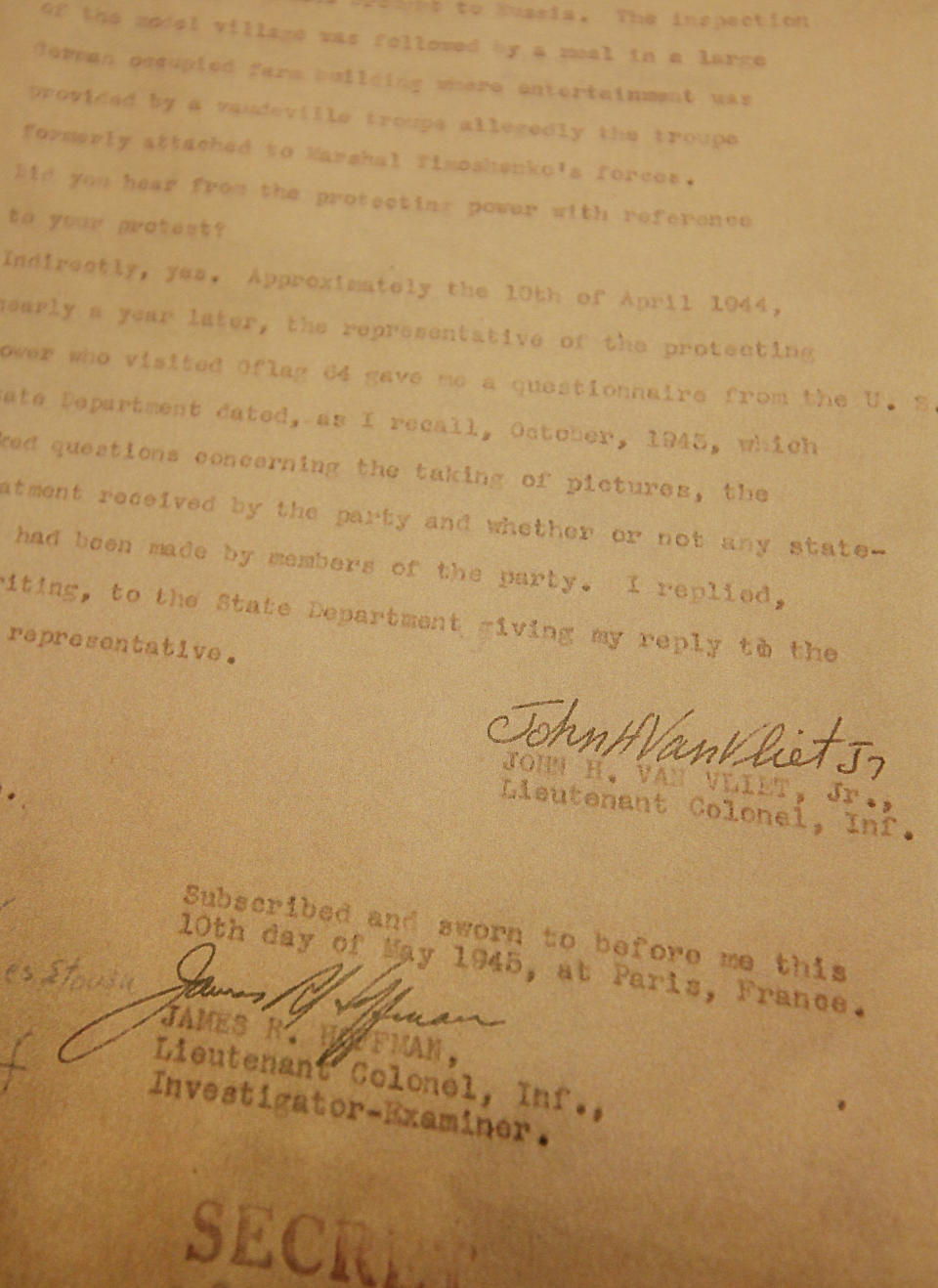 This picture taken in Warsaw, Poland, on Wednesday, Jan. 8, 2014, shows a copy of the last page of what is believed the recently uncovered vital testimony made in 1945 in Paris by U.S. Lt. Col. John H. Van Vliet Jr. It provides evidence of Soviet responsibility for the World War II massacre of some 22,000 Polish officers in Katyn forest and other locations in then-Soviet Union. Researcher Krystyna Piorkowska says she found it in November in archives near Washington, among wartime documents of the U.S. Embassy in Paris. (AP Photo/Czarek Sokolowski)