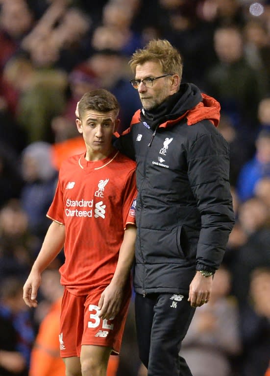 Liverpool's manager Jurgen Klopp (R) speaks to midfielder Cameron Brannagan at the end of their English FA Cup 4th round match against West Ham United, at Anfield in Liverpool, on January 30, 2016