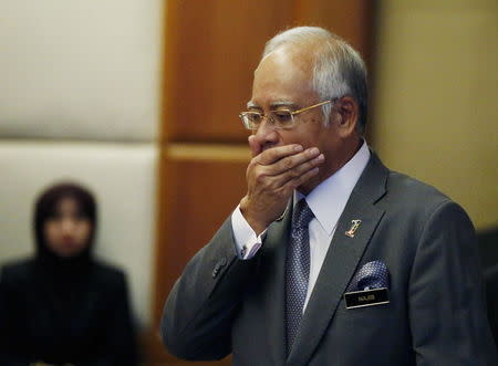 Malaysia's Prime Minister Najib Razak arrives at a presentation for government interns at the Prime Minster's office in Putrajaya, Malaysia, in this July 8, 2015 file photo. REUTERS/Olivia Harris/Files