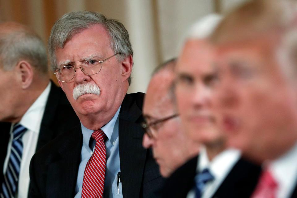 National Security Adviser John Bolton listens to President Donald Trump speak during a working lunch with Japanese Prime Minister Shinzo Abe at Trump' s private Mar-a-Lago club in Palm Beach, Fla., on April 18, 2018.