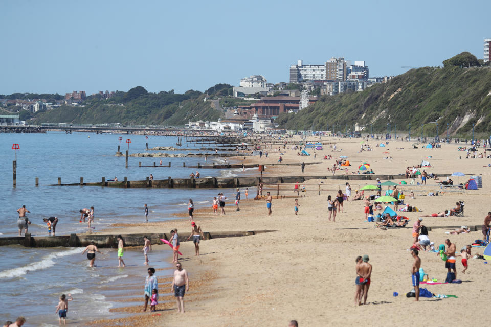 People enjoy the hot weather between Bournemouth beach and Boscombe beach in Dorset, following the introduction of measures to bring the country out of lockdown.