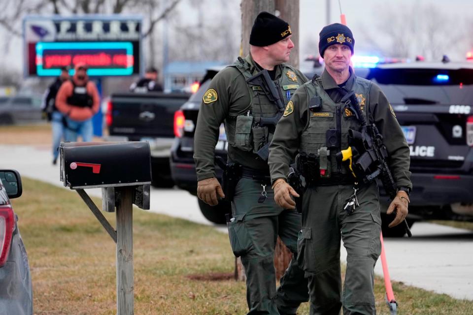 PHOTO: Police respond to Perry High School in Perry, Iowa., Jan. 4, 2024. (Andrew Harnik/AP)