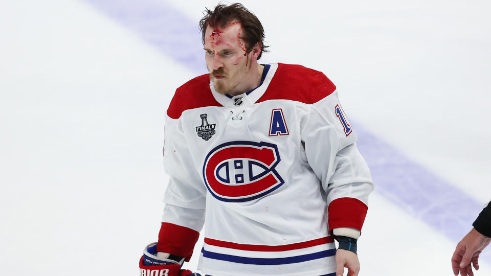 TAMPA, FL - JUNE 28:  A bloody Brendan Gallagher #11 of the Montreal Canadiens skates off the ice after a post whistle scrum against the Tampa Bay Lightning during the third period in Game One of the Stanley Cup Final of the 2021 Stanley Cup Playoffs at Amalie Arena on June 25, 2021 in Tampa, Florida. (Photo by Mark LoMoglio/NHLI via Getty Images)