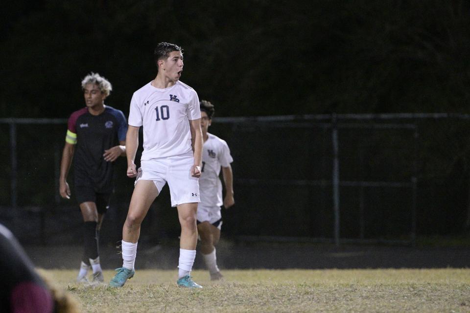 West Boca's Raul Calvi celebrates his goal after scoring in spectacular fashion against Dwyer. Calvi scored three goals in the match to help the Bulls secure the district title on Jan. 31, 2023.