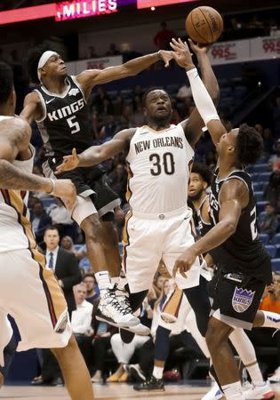 Mar 28, 2019; New Orleans, LA, USA; New Orleans Pelicans center Julius Randle (30) shoots over Sacramento Kings guard De'Aaron Fox (5) and guard Buddy Hield (24) during the fourth quarter at the Smoothie King Center. Mandatory Credit: Derick E. Hingle-USA TODAY Sports