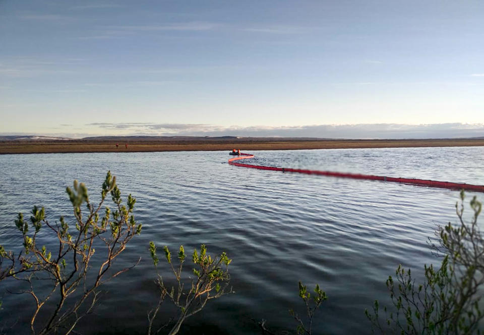 FILE - In this handout file photo dated Tuesday, June 2, 2020, provided by the Russian Marine Rescue Service, rescuers work to prevent the spread from an oil spill outside Norilsk, 2,900 kilometers (1,800 miles) northeast of Moscow, Russia. Russian President Vladimir Putin on Friday June 19, 2020, has ordered his government to fully repair environmental damage from a massive fuel leak in the Arctic. A power plant in the Siberian city of Norilsk leaked 20,000 tons of diesel fuel into the ecologically fragile region when a storage tank collapsed on May 29. (Russian Marine Rescue Service via AP, File)