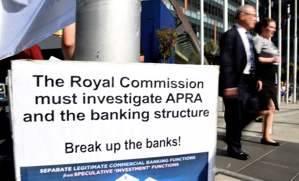 A photo taken in Melbourne on April 23, 2018 show a placard outside the royal commission set up in February to investigate misconduct in the banking sector. - Australian finance company AMP's chairman Catherine Brenner quit on April 30, 2018, barely a week after its chief executive stood down as damning evidence of misconduct by the firm continues to mount. (Photo by William WEST / AFP)        (Photo credit should read WILLIAM WEST/AFP via Getty Images)