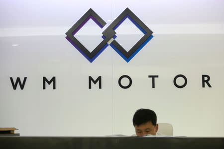 An employee of WM Motor Technology Co., Ltd. works at his office in shanghai, China, August 1, 2016. REUTERS/Aly Song