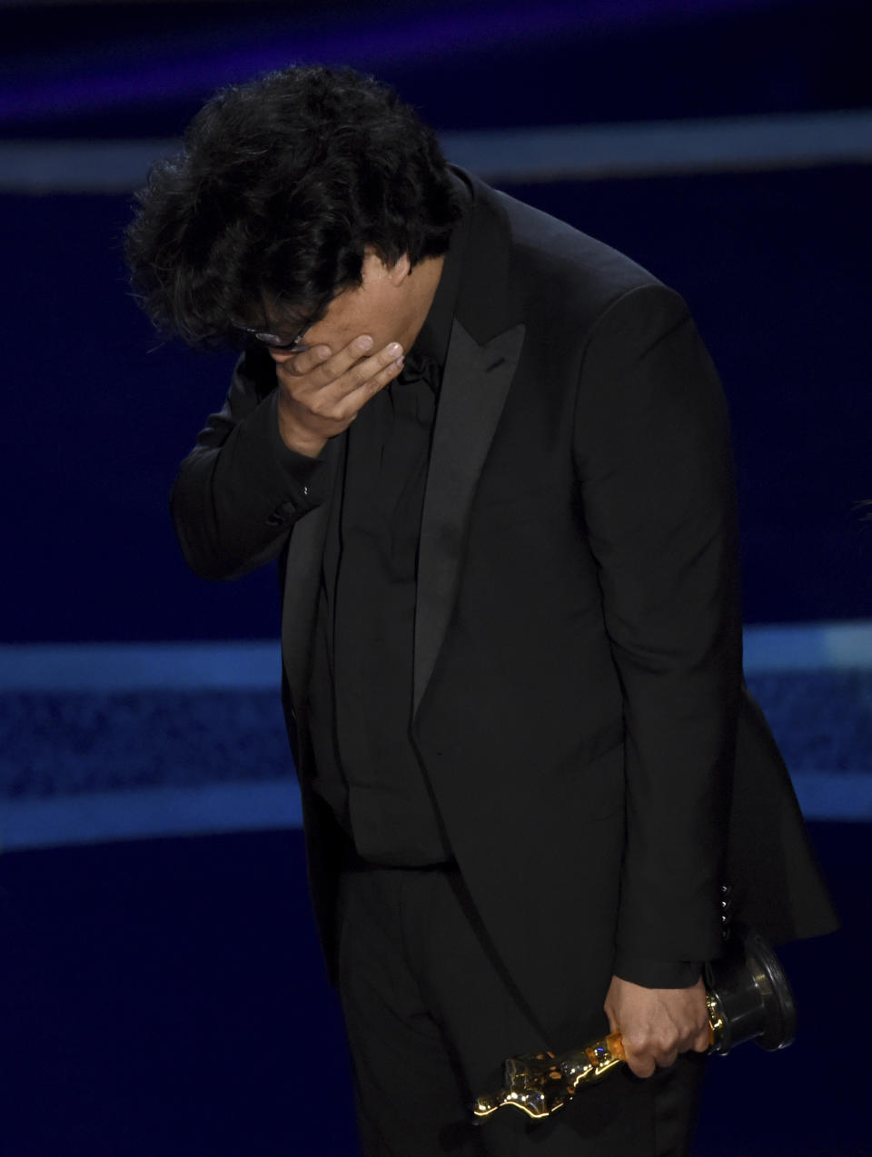 Bong Joon Ho reacts as he accepts the award for best director for "Parasite" at the Oscars on Sunday, Feb. 9, 2020, at the Dolby Theatre in Los Angeles. (AP Photo/Chris Pizzello)