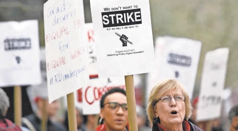 Dozens of union members and supporters picketed for three hours on Tuesday, April 9, 2019, outside the Paul Robeson Campus Center on the Rutgers-Newark campus, where the governing board met for the last time that semester.