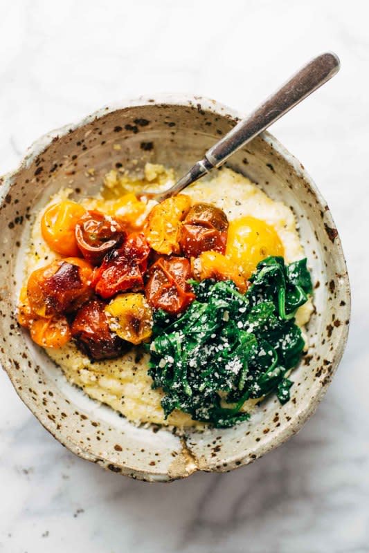 <p>Pinch of Yum</p><p>Roasted tomatoes with goat cheese polenta—an easy vegetarian recipe adaptable to whatever veggies you have on hand. Healthy meets comfort food!</p><p><strong>Get the recipe: <a href="https://pinchofyum.com/roasted-tomatoes-with-goat-cheese-polenta" rel="nofollow noopener" target="_blank" data-ylk="slk:Roasted Tomatoes with Goat Cheese Polenta;elm:context_link;itc:0;sec:content-canvas" class="link ">Roasted Tomatoes with Goat Cheese Polenta</a></strong></p>