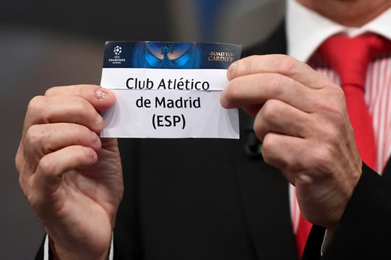 Welsh former player Ian Rush shows the name of Atletico Madrid football club during the UEFA Champion's league draw semi-finals, on April 21, 2017 in Nyon