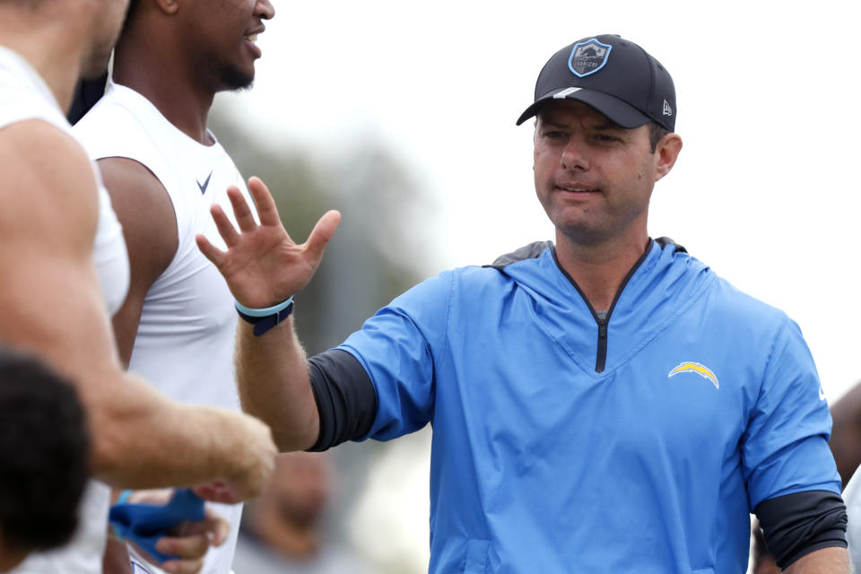 Los Angeles Chargers head coach Brandon Staley greets players at NFL football practice in Costa Mesa, Calif., Friday, Aug. 6, 2021. (AP Photo/Alex Gallardo)