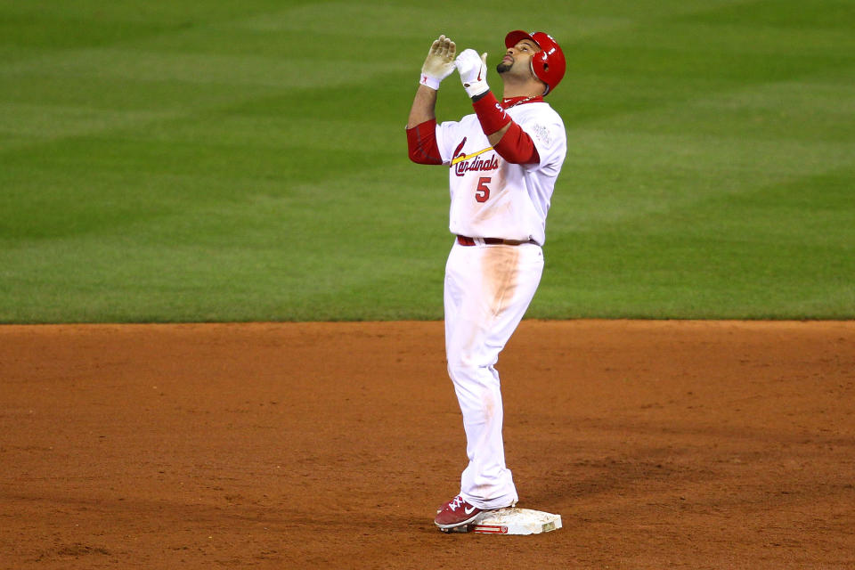 ST LOUIS, MO - OCTOBER 27: Albert Pujols #5 of the St. Louis Cardinals celebrates after hitting a double in the ninth inning during Game Six of the MLB World Series against the Texas Rangers at Busch Stadium on October 27, 2011 in St Louis, Missouri. (Photo by Dilip Vishwanat/Getty Images)