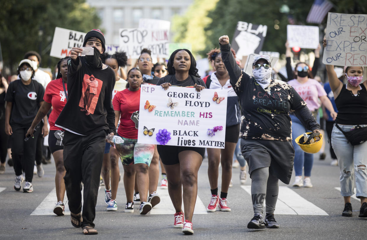 Protesters march in honor of George Floyd in downtown Raleigh, N.C., on Monday, the day a local LGBTQ bar owner says he was the subject of aggressive police tactics. (Julia Wall/The News & Observer via AP)