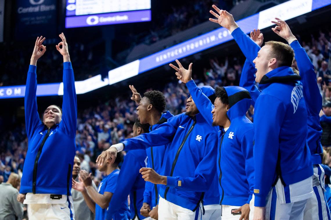 The Kentucky bench celebrates a three-point shot by CJ Fredrick during Tuesday’s game against Georgia at Rupp Arena.