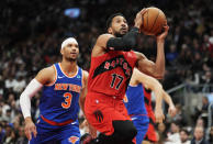 Toronto Raptors forward Garrett Temple (17) drives as New York Knicks guard Josh Hart (3) watches during the first half of an NBA basketball game Wednesday, March 27, 2024, in Toronto. (Frank Gunn/The Canadian Press via AP)