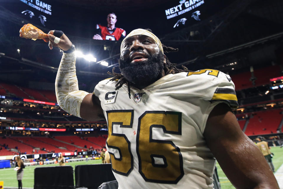 ATLANTA, GA - NOVEMBER 28: Demario Davis #56 of the New Orleans Saints holds a turkey leg as he heads off the field following the game against the Atlanta Falcons at Mercedes-Benz Stadium on November 28, 2019 in Atlanta, Georgia. New Orleans Saints won against Atlanta Falcons 26-18. (Photo by Carmen Mandato/Getty Images)