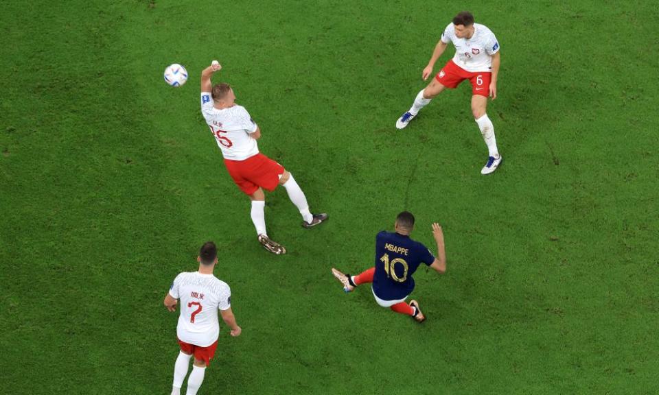 Kylian Mbappé scores France’s third goal against Poland and his fifth of the tournament with a right-foot shot.