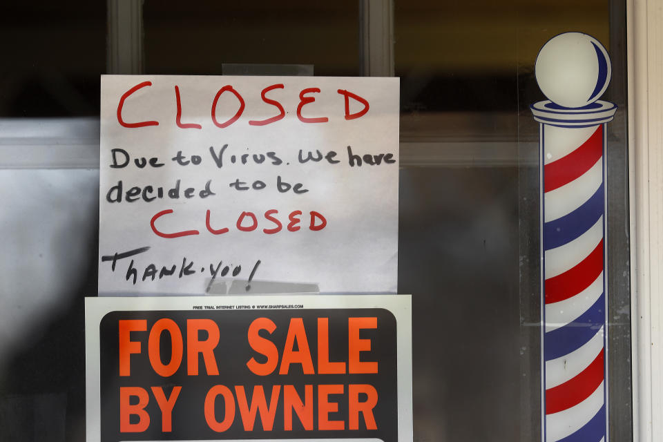 "For Sale By Owner" and "Closed Due to Virus" signs are displayed in the window of Images On Mack in Grosse Pointe Woods, Mich., Thursday, April 2, 2020. The coronavirus outbreak has triggered a stunning collapse in the U.S. workforce with 10 million people losing their jobs in the past two weeks and economists warn unemployment could reach levels not seen since the Depression, as the economic damage from the crisis piles up around the world. (AP Photo/Paul Sancya)