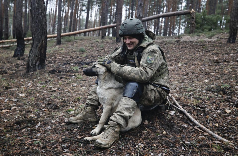 A Ukrainian serviceman take a rest on the frontline at an undisclosed location in the Donetsk region, Ukraine, Saturday, Nov. 26, 2022. (AP Photo/Roman Chop)