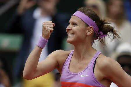 Lucie Safarova of the Czech Republic celebrates after defeating Maria Sharapova of Russia during their women's singles match during the French Open tennis tournament at the Roland Garros stadium in Paris, France, June 1, 2015. REUTERS/Gonzalo Fuentes