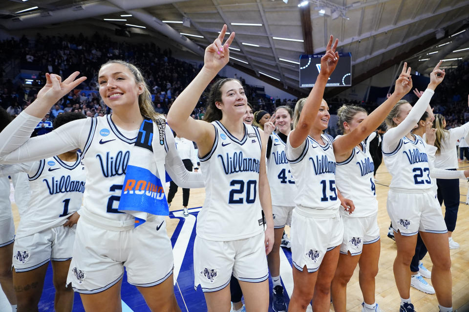 Villanova players including Maddy Siegrist (20) celebrate winning college basketball game against the Cleveland State in the NCAA Tournament, Saturday, March 18, 2023, in Villanova, Pa. (AP Photo/Matt Rourke)