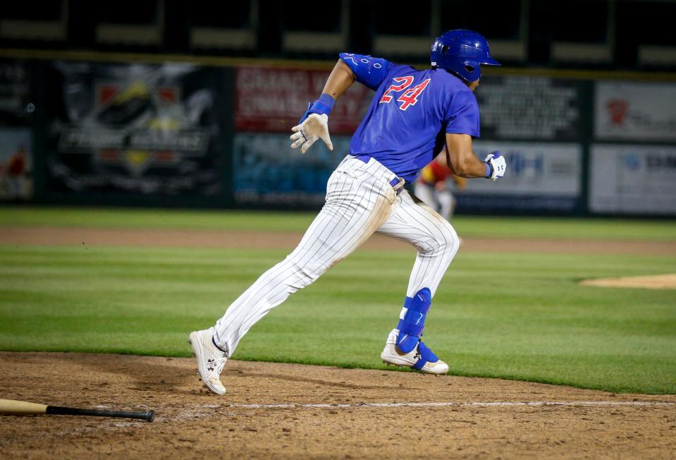 Iowa's Brennen Davis runs to first base after hitting the ball against Toledo during a Triple-A baseball game at Principal Park in Des Moines on April 12, 2022.