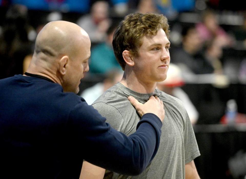 Penn State wrestling coach Cael Sanderson pumps up Bernie Truax before his first match of the Big Ten Wresting Championships at the Xfinity Center at the University of Maryland on Saturday, March 9, 2024. Abby Drey/adrey@centredaily.com