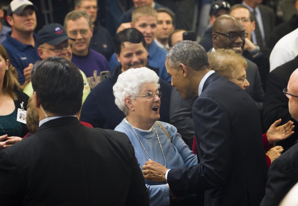 President Barack Obama greets guests after speaking about increasing access to high-speed and affordable internet at Cedar Falls Utilities in Cedar Falls, Iowa, January 14, 2015. The town of Cedar Falls has built its own private high-speed internet network and runs it like a public utility.