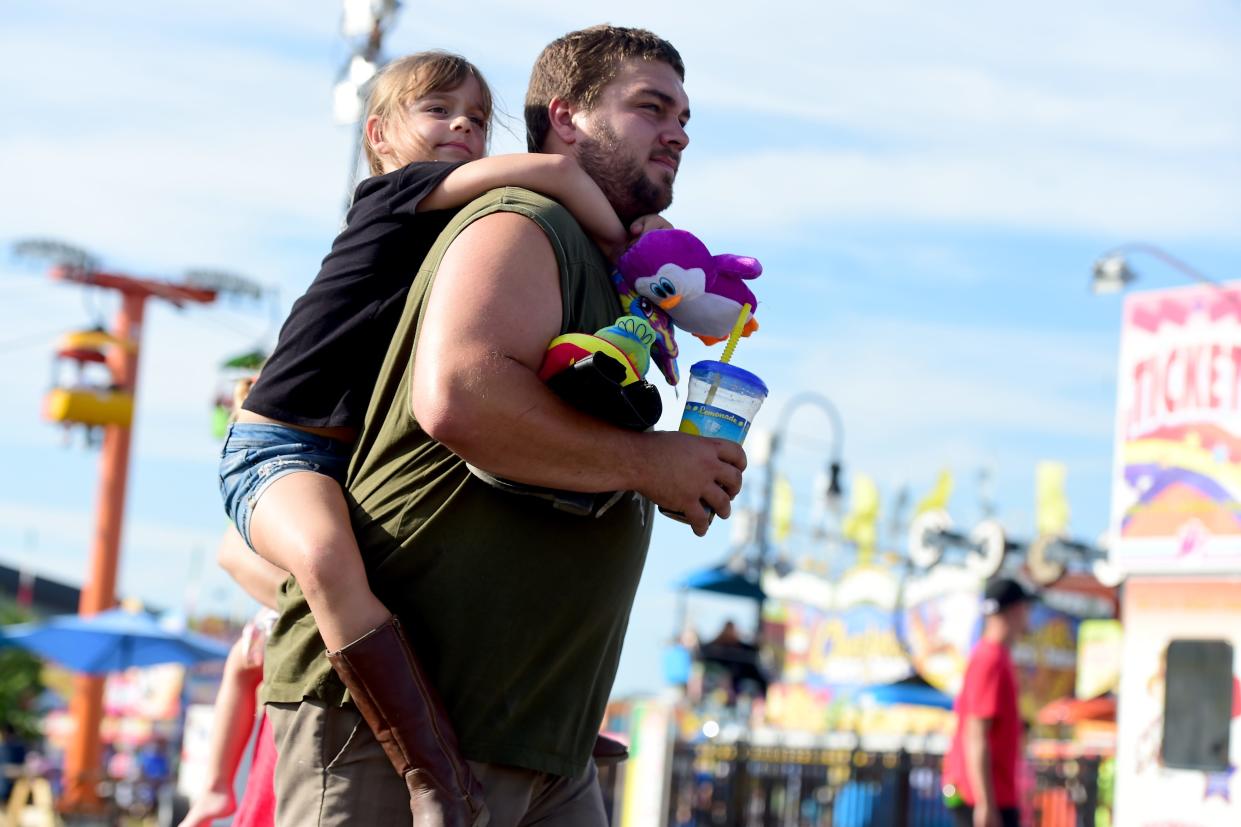 A 2018 file photo of attendees at the Great New York State Fair at the Fairgrounds near Syracuse on August 30, 2018.