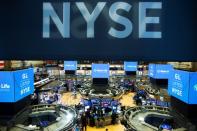 Traders work on the floor at the New York Stock Exchange (NYSE) in New York