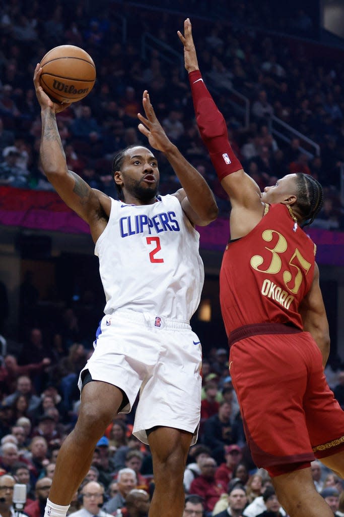 Los Angeles Clippers forward Kawhi Leonard (2) shoots against Cleveland Cavaliers forward Isaac Okoro (35) during the first half of an NBA basketball game, Monday, Jan. 29, 2024, in Cleveland. (AP Photo/Ron Schwane)
