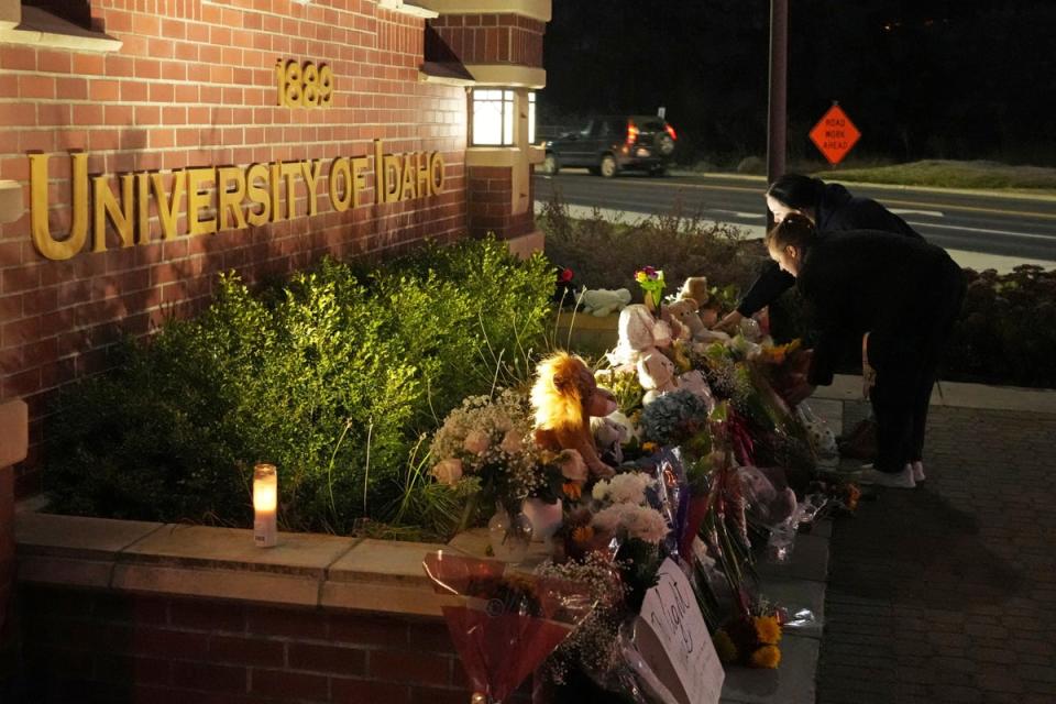 A growing memorial in front of a campus entrance sign for the University of Idaho (AP)