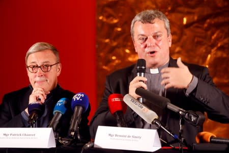 Notre-Dame de Paris Cathedral rector Patrick Chauvet and Mgr Benoist De Sinety attend a news conference in Paris