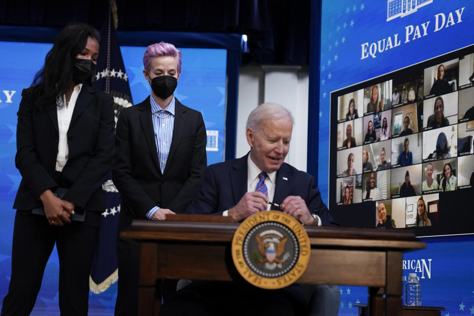 USWNT players Margaret Purce, left, and Megan Rapinoe met with President Joe Biden at an Equal Pay Day event at the White House last week. (AP Photo/Evan Vucci)
