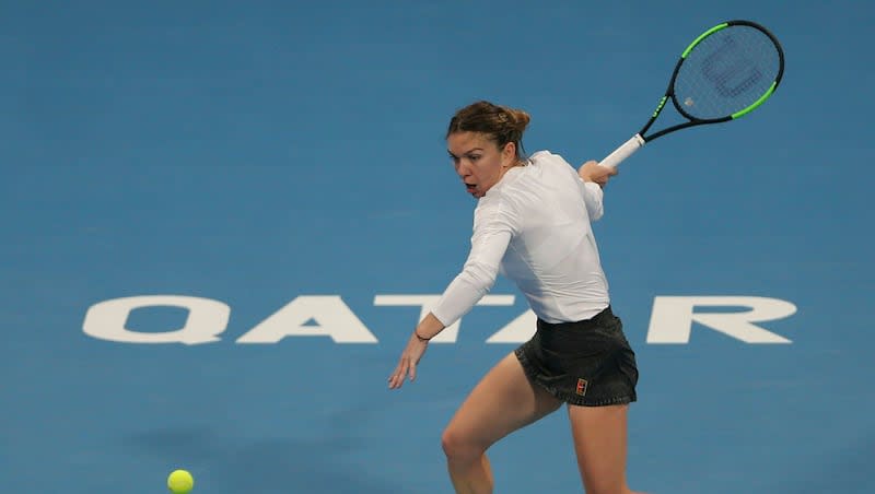 Romania's Simona Halep returns the ball to Ukraine's Elina Svitolina during a semifinal match of the Qatar Open tennis tournament in Doha, Qatar, Friday, Feb. 15, 2019.