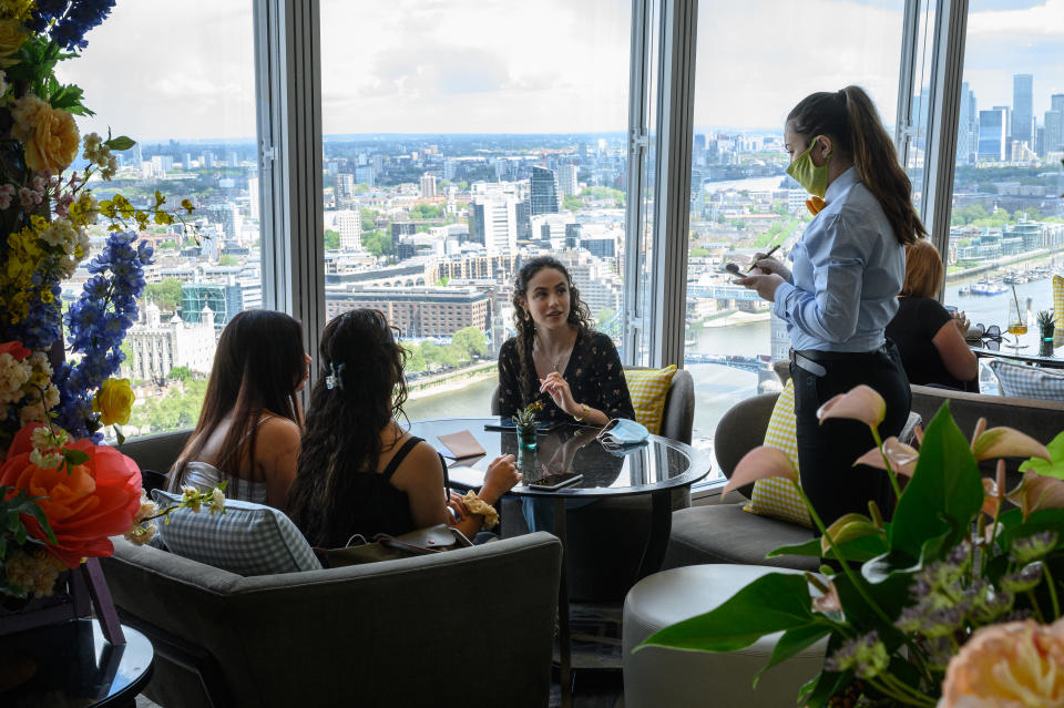 LONDON, ENGLAND - MAY 19: Guests enjoy their meals at the Tang restaurant within the Shangri-La Hotel at The Shard on May 19, 2021 in London, England. From May 17, a wide raft of changes have been made to the lockdown restrictions, including allowing people in groups of up to 30 to meet outdoors, hotels can accept guests, and pubs, bars, cafes and restaurants can serve customers indoors. (Photo by Leon Neal/Getty Images)