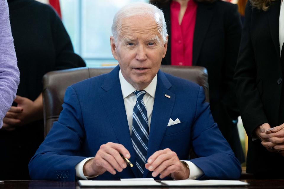 President Biden speaks to reporters in the Oval Office on Monday.