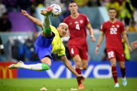 Brazil's forward Richarlison, left, scores the second goal for his team during the World Cup group G soccer match between Brazil and Serbia, at the the Lusail Stadium in Lusail, Qatar on Thursday, Nov. 24, 2022. (Laurent Gillieron/Keystone via AP)