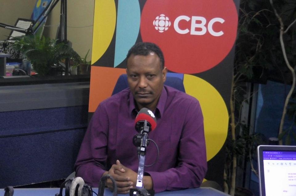 Modathir Bashir at CBC'S Edmonton AM studios talking about the federal government's program to bring Sudanese fleeing war to Canada. (CBC Edmonton - image credit)