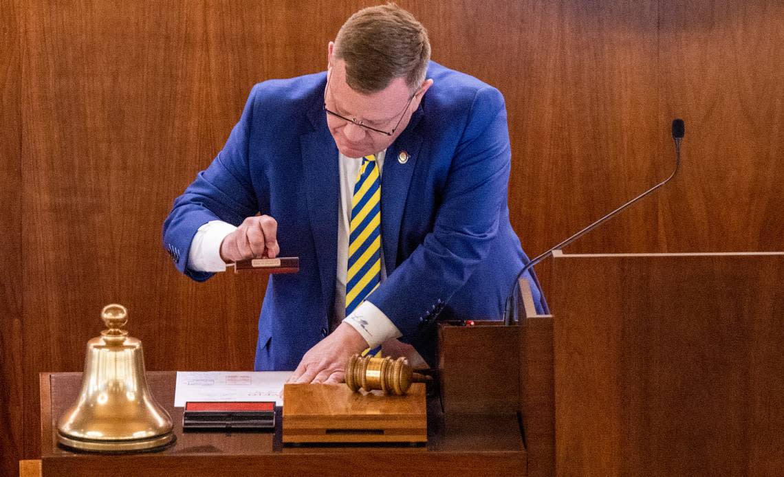 North Carolina House speaker Tim Moore stamps a veto override after a vote to overturn Gov. Roy Cooper’s veto of an abortion restriction bill Tuesday, May 16, 2023, at the Legislative Building in Raleigh, N.C. Travis Long/tlong@newsobserver.com