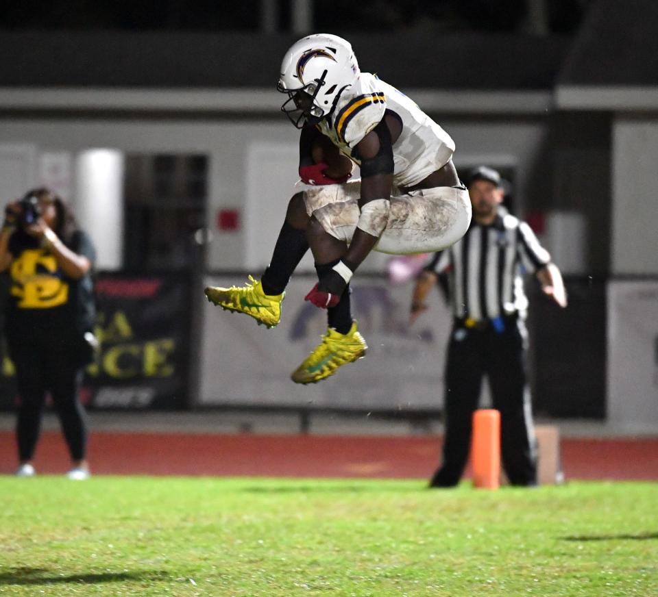 Lehigh running back Richard Young (,#9) leaps untouched into the end zone to give his team the lead, 9-3 over Palmetto in the second quarter. The Palmetto Tigers hosted the Lehigh Lightning in the FHSAA class 4S playoffs Friday night, Nov. 11, 2022. 