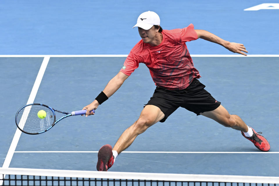 Taro Daniel of Japan plays a forehand return to Alejandro Tabilo of Chile during the final of the ASB Classic tennis tournament in Auckland, New Zealand, Saturday, Jan. 13, 2024. (Andrew Cornaga/Photosport via AP)