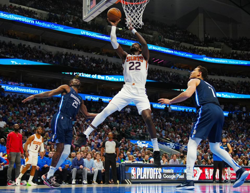 May 12, 2022; Dallas, Texas; USA; Suns Deandre Ayton (22) puts back an offensive board for a basket against Mavericks Reggie Bullock (25) during game 6 of the second round of the Western Conference Playoffs.