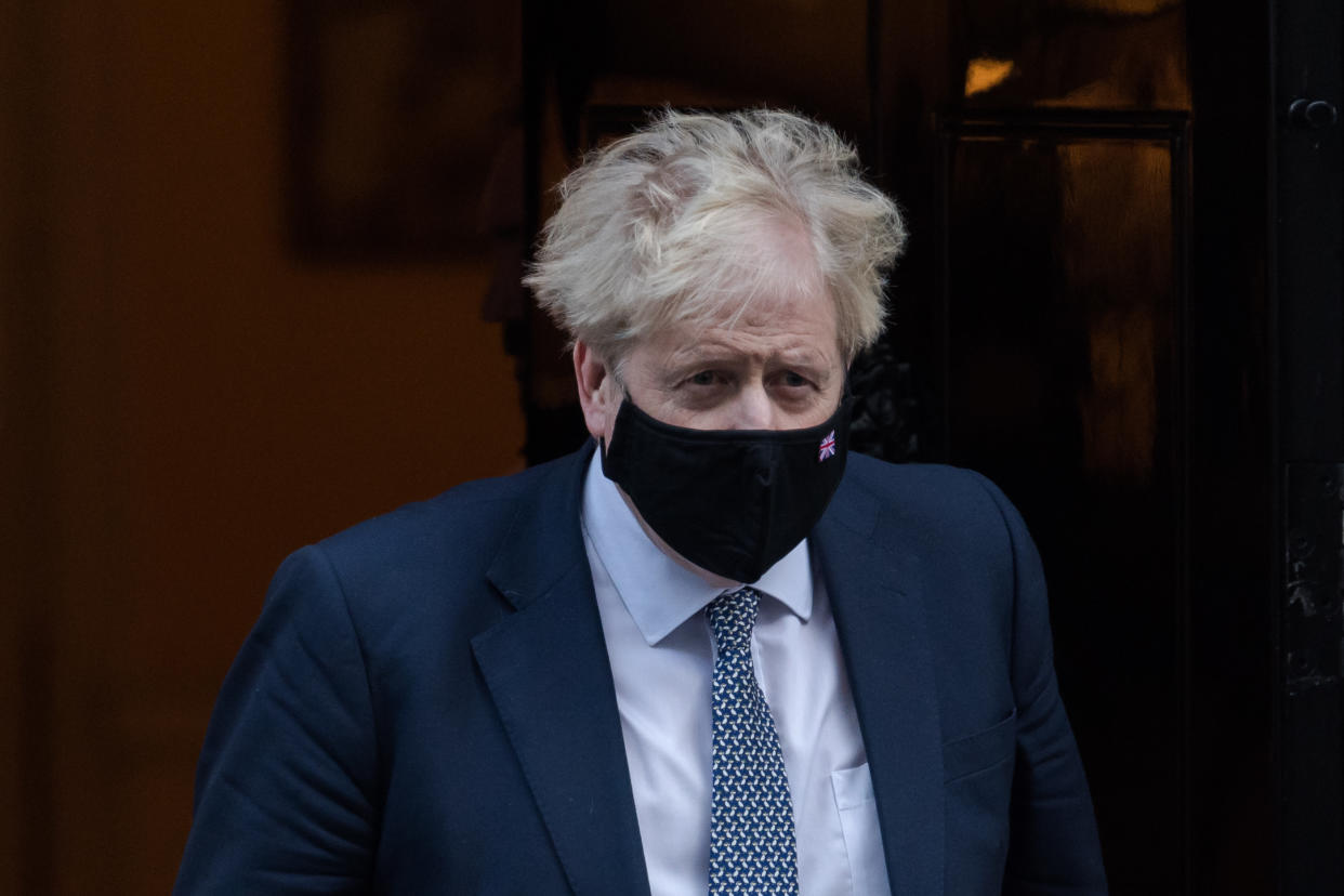 LONDON, UNITED KINGDOM - JANUARY 12, 2022: British Prime Minister Boris Johnson leaves 10 Downing Street for PMQs at the House of Commons on January 12, 2022 in London, England. Boris Johnson is facing pressure over alleged gathering of No 10 staff in Downing Street garden on 20 May 2020 at a time when strict Covid-19 lockdown measures were in place. (Photo credit should read Wiktor Szymanowicz/Future Publishing via Getty Images)